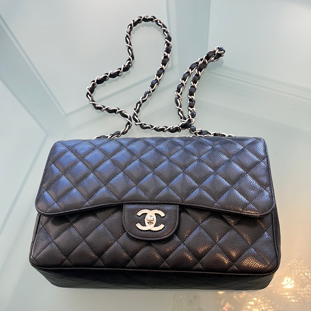 Woman’s Chanel bag, authentic black caviar, medium